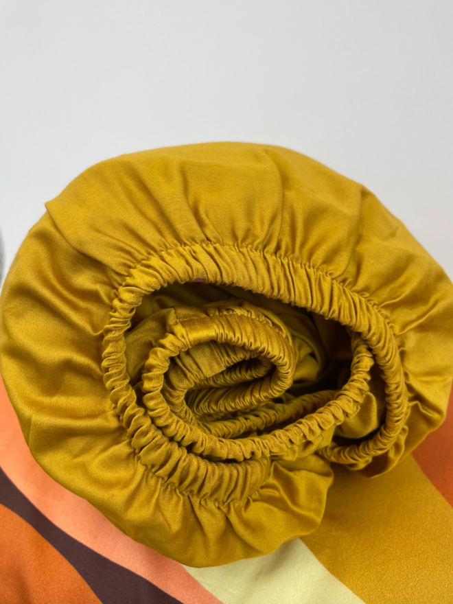 Honey Mustard Fitted Sheet. A deep yellow fitted sheet.