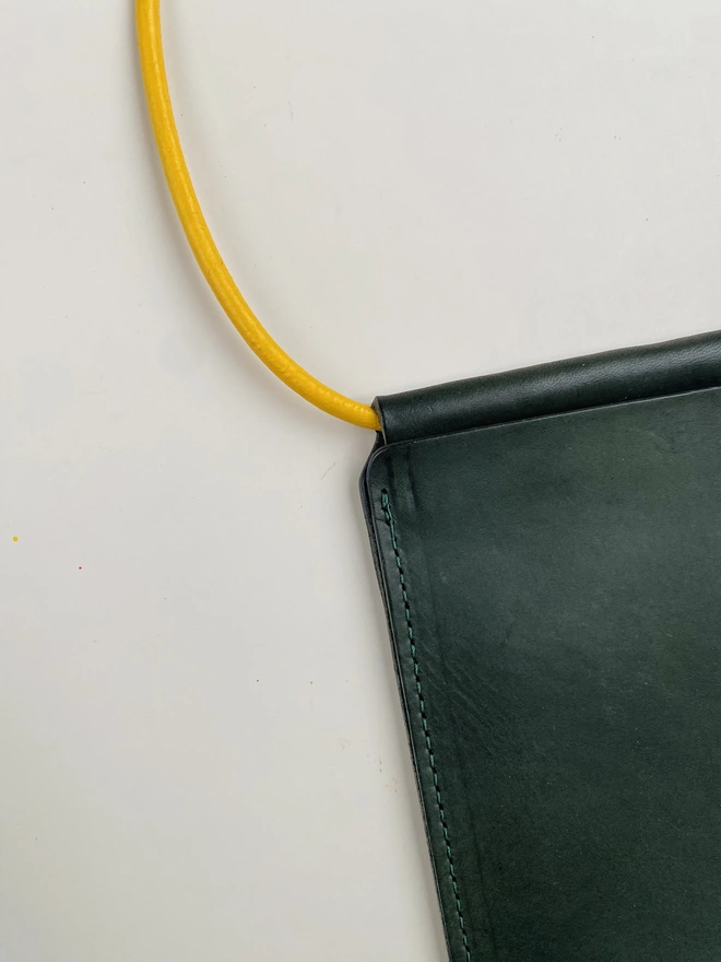 Leather phone bag with colourful strap