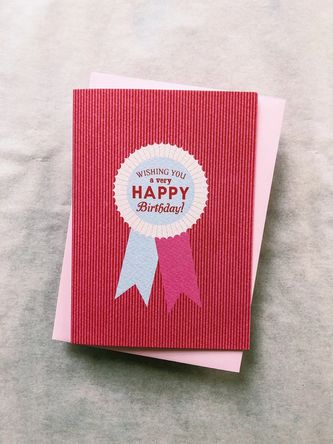 'Happy Birthday Badge' Charity Greeting Card Flora Fricker Vintage Badge in red and pink