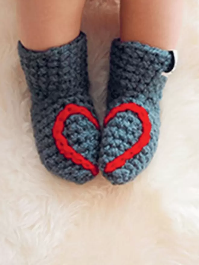 Baby booties with heart embroidery