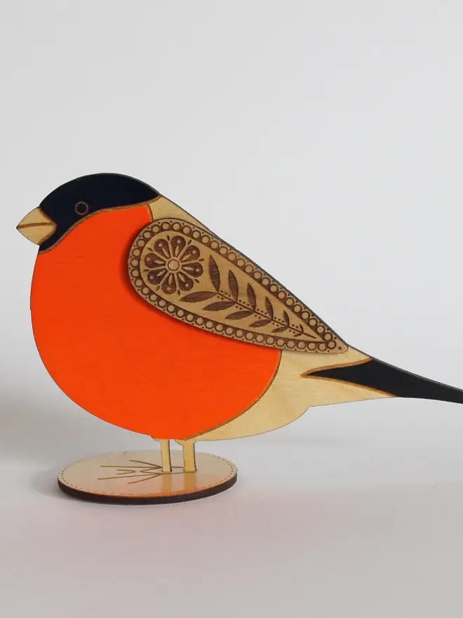 Standing Wooden BullFinch,Standing Wooden BullFinch, orange wooden bird decoration standing on a platform. 