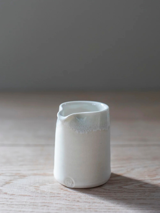 white handleless porcelain jug