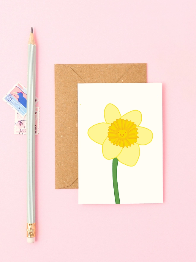 A bright yellow hand-drawn daffodil with a smiling face, perfect for Easter, Mother’s Day, or celebrating spring.