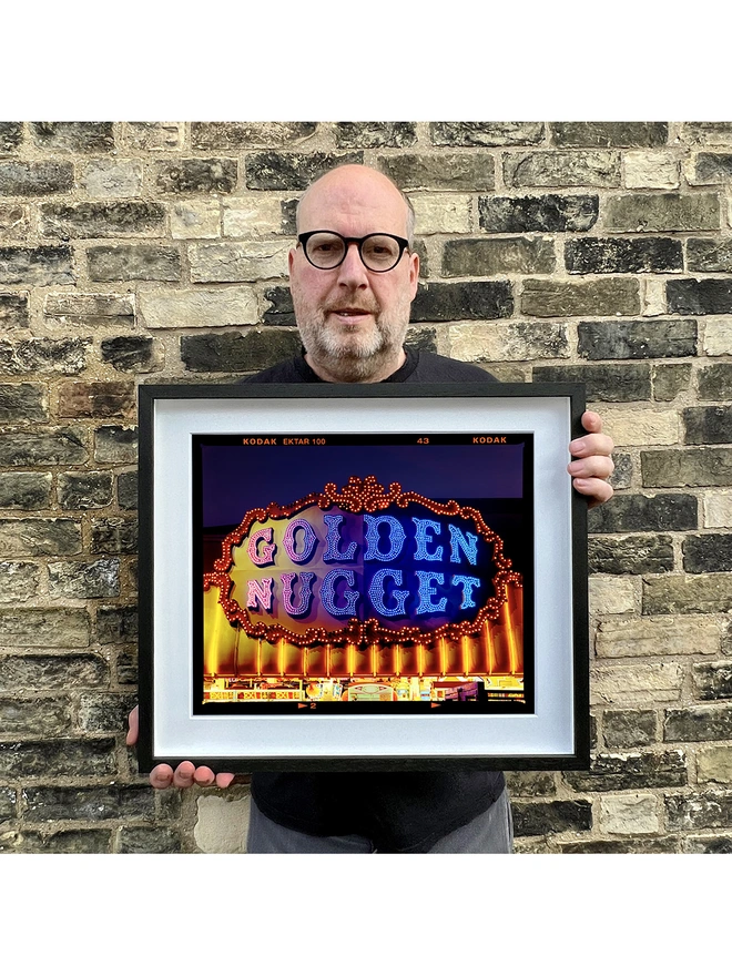 Golden Nugget Richard Heeps holding small black frame