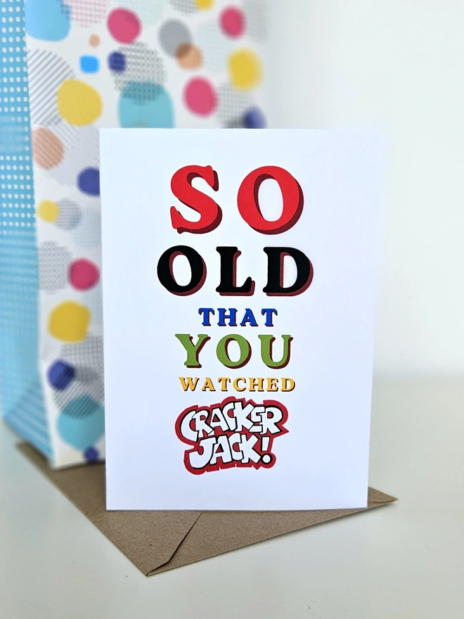 A nostalgic card that says So old that you watched Cracker Jack in colourful retro style fonts on a white background. 