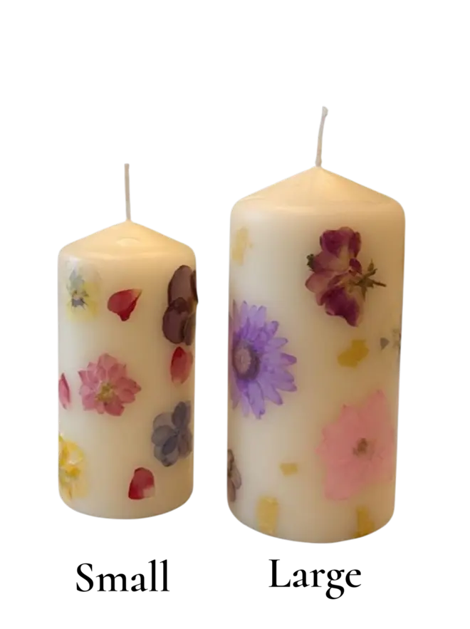 small and large pillar candles with pressed flowers