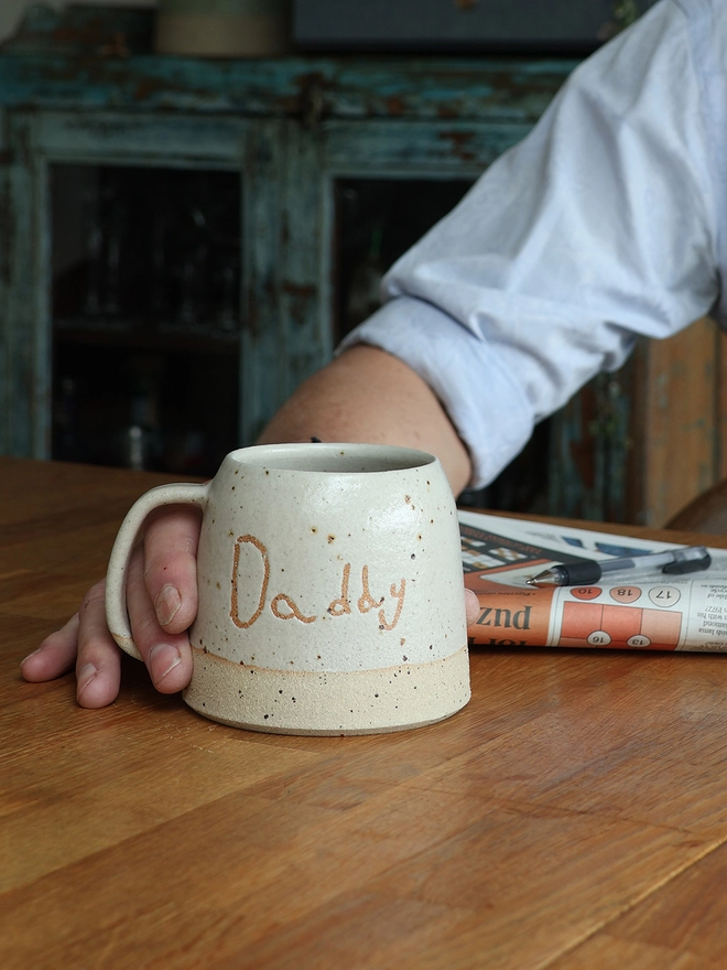 Personalised Kids' Handwriting Handmade Stoneware Mug held on table