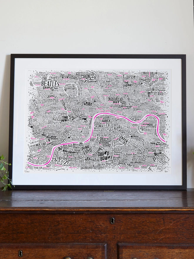 Music Map in a frame on a sideboard