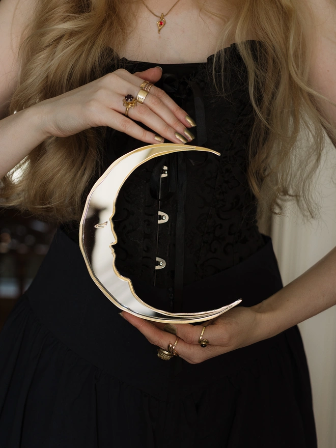 silver and gold crescent mirror moon