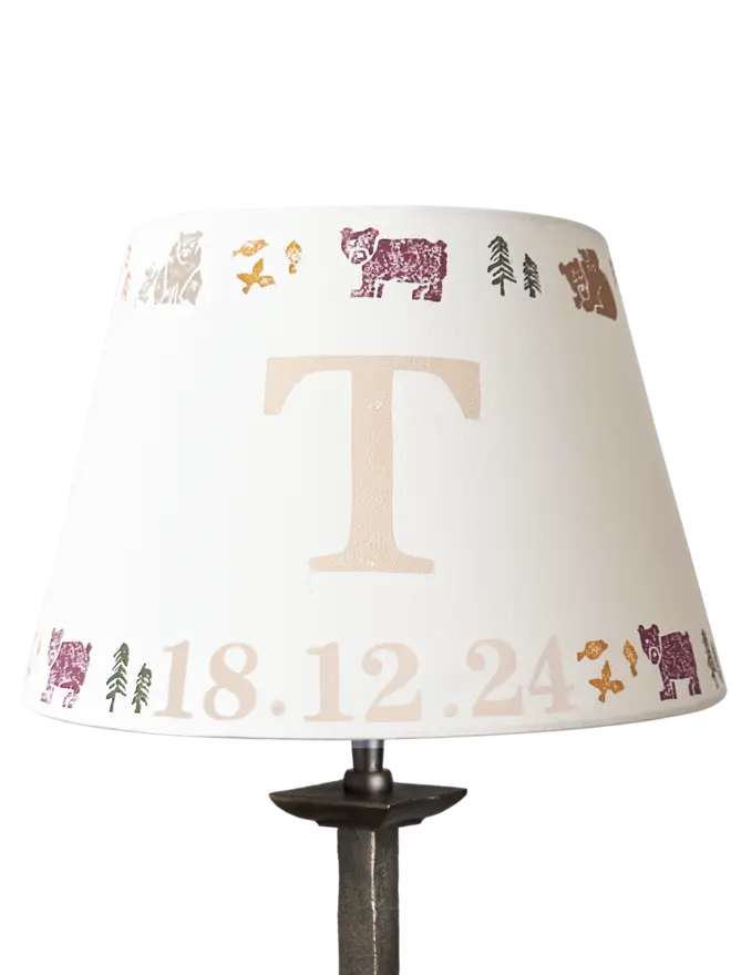 Studio Zef personalised bear lampshade with colourful animal print and large initial 'T'. An empire lampshade designed for kids lighting and thoughtful new parent gifts.