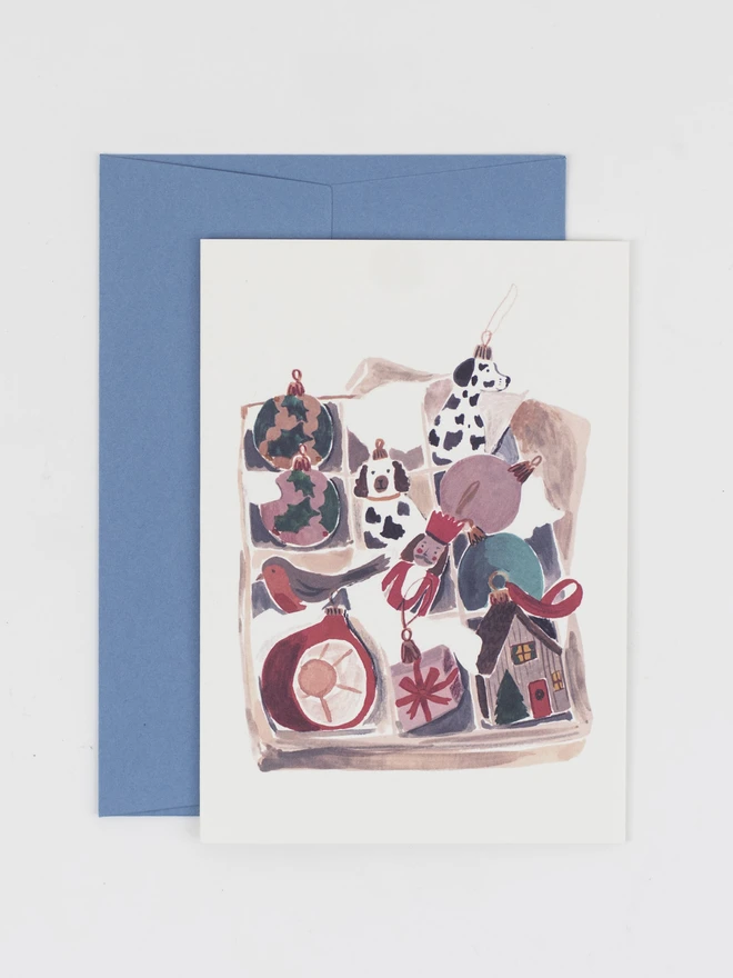 A christmas card featuring an illustrated collection of Christmas ornaments. 