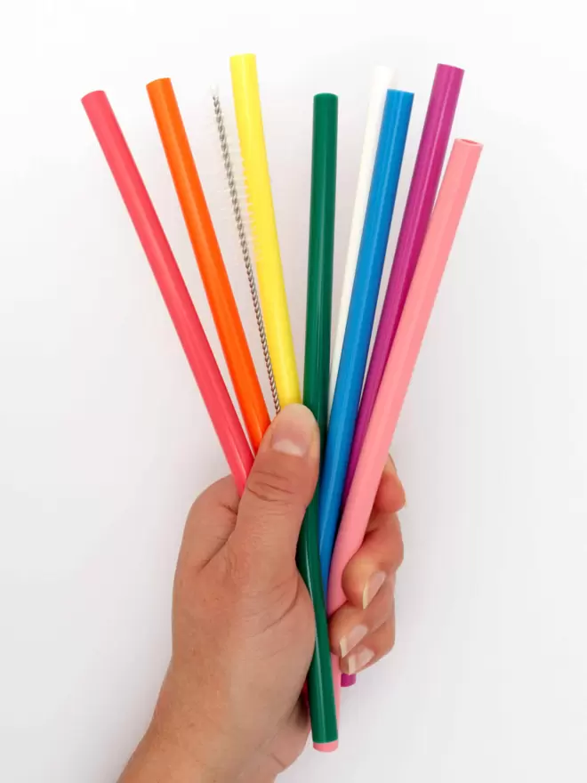 Colourful reusable straws in the hand