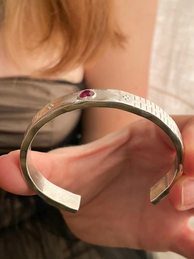 Sacred Engraved Silver Cuff Bracelet With Ruby Heart