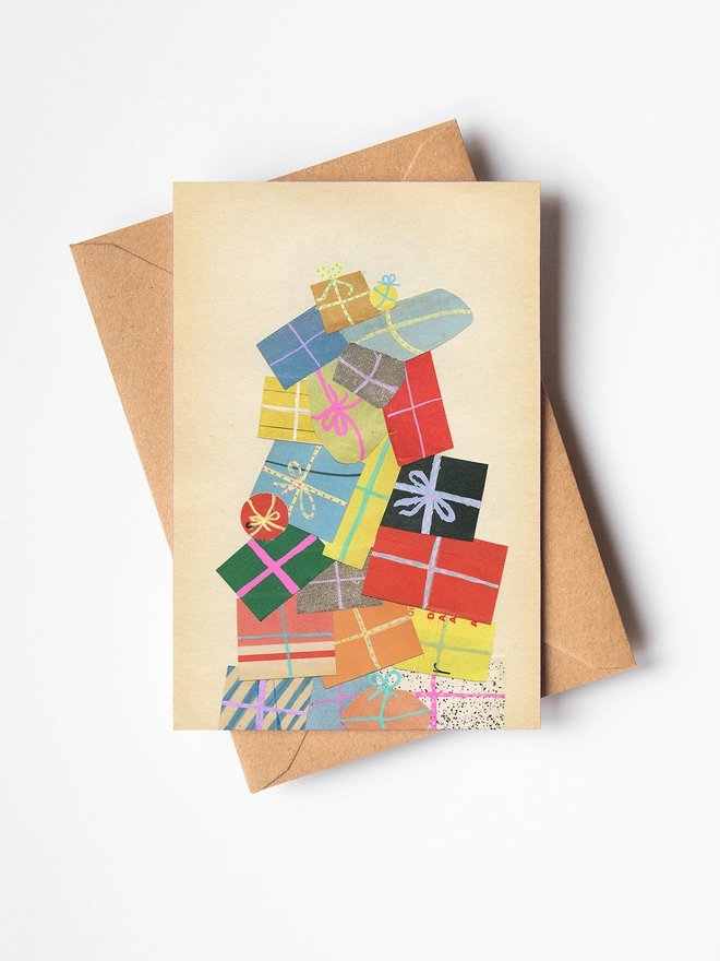 A charming Christmas card featuring a huge pile of colourful wrapped presents.