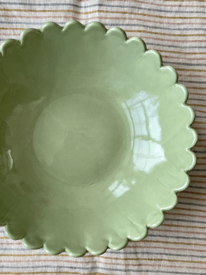 top view sage green small daisy edge scalloped serving bowl