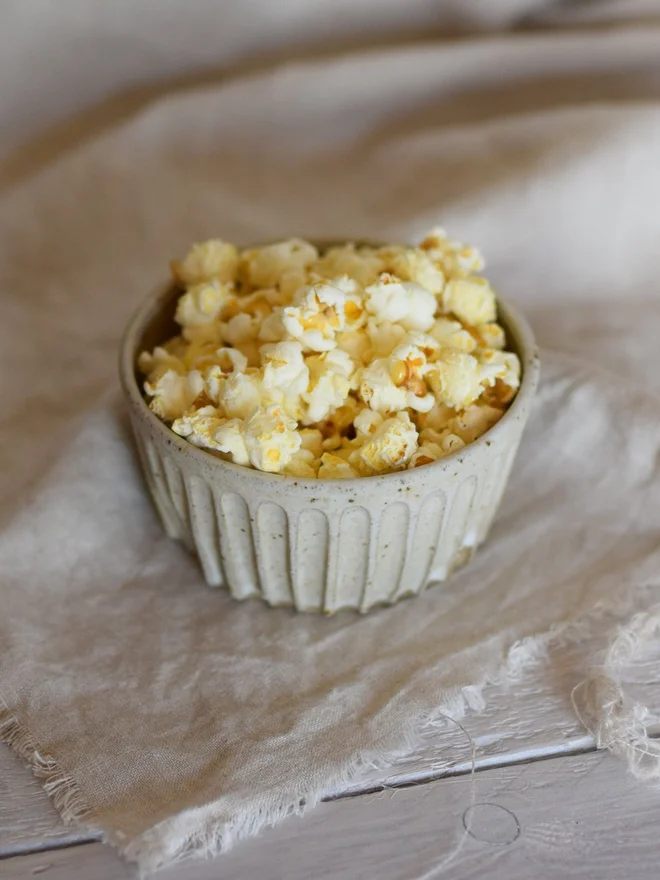 stoneware textured snack bowl with popcorn