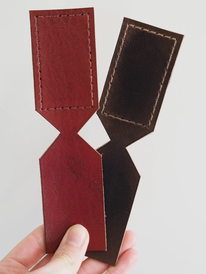 Hand dyed oxblood red and dark brown leather key rings waiting to be personalised