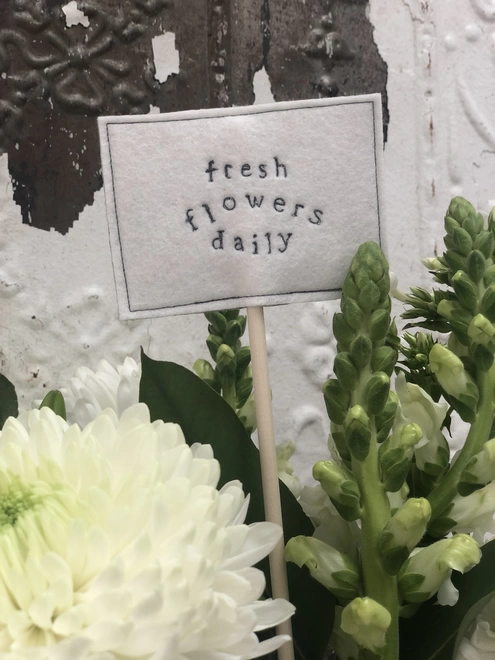 fresh flowers served daily sign