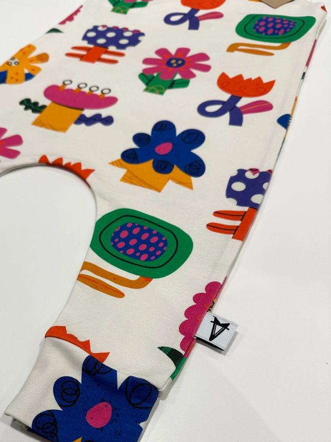 Baby romper in collage flower print fun baby romper colourful and bright