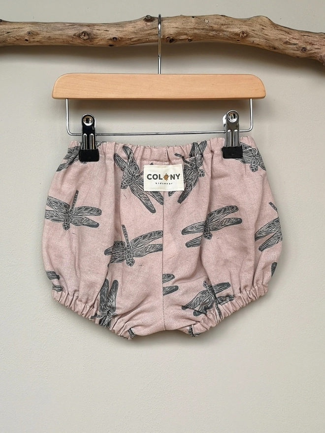 Pink Cotton Linen Baby Bloomers. Elasticated waist and leg holes. Featuring a delicate charcoal grey dragonfly print.