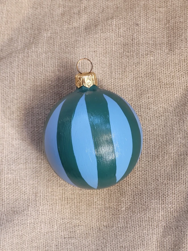 Sky blue bauble with dark green stripes