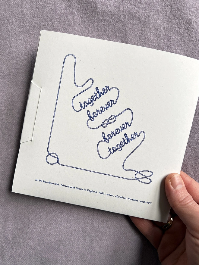 The back of the wallet package of the Mr.PS Together Forever Handkerchief showing the design overall