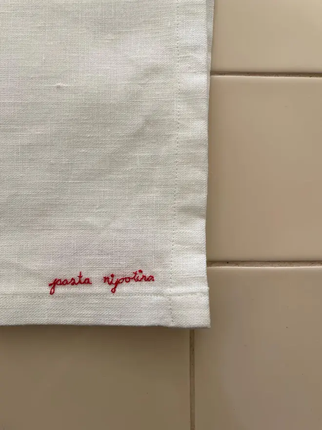 Personalised Hand Embroidered Linen Napkins (Set Of 2), two white napkins with a red personalised message