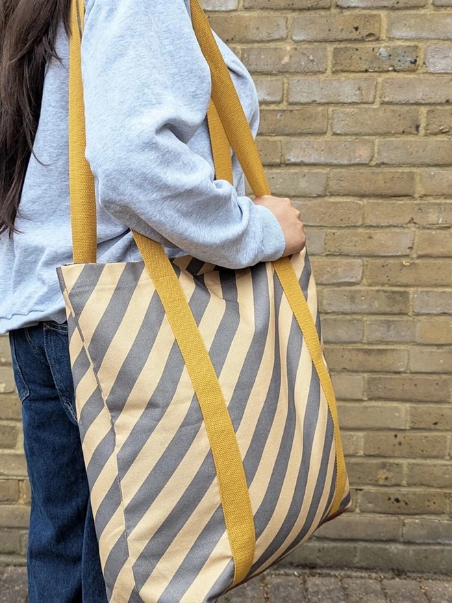 Tote Cotton Shopper Bag, a woman holding a colourful patterned tote bag over her shoulder. 