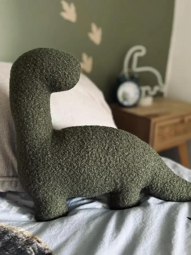 boucle dinosaur pillows. a green diplodocus.