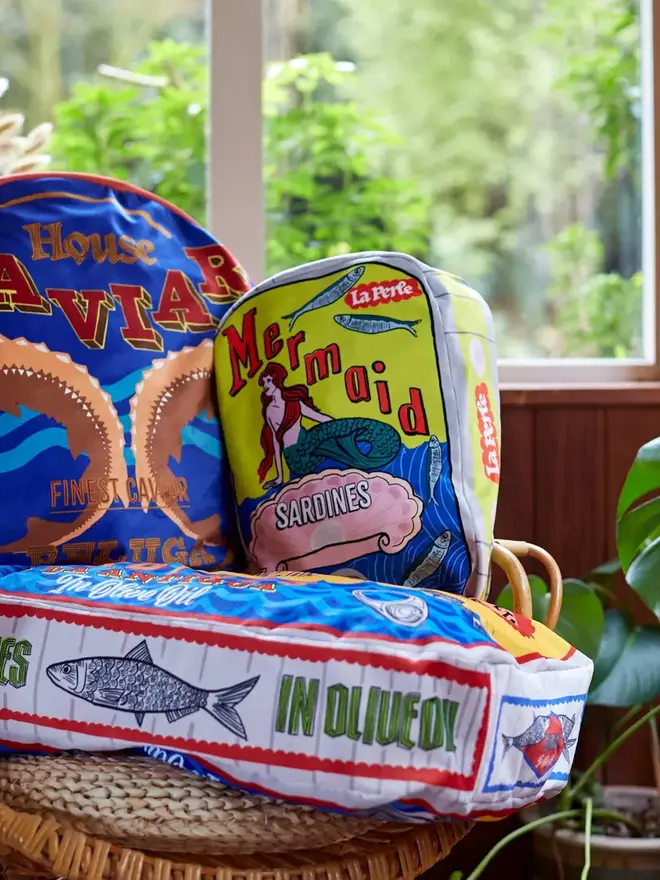 Mermaid Tin Cushion, a decorated mermaid cushion sitting on a window sill. 