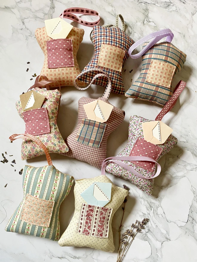 the backs of tooth fairy decorations showingpretty fabrics and note lets in tiny envelopes