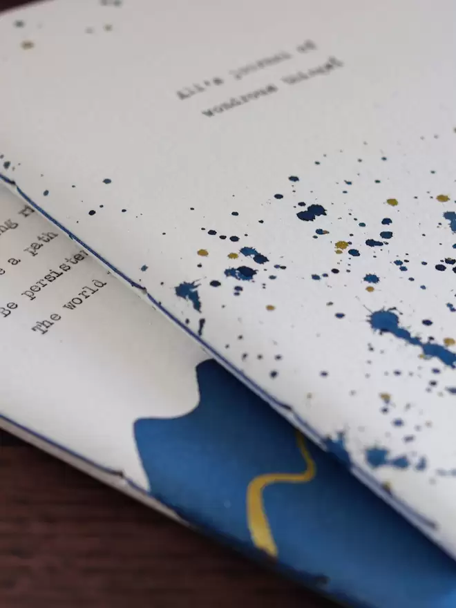 close up of hand painted blue and gold personalised notebook