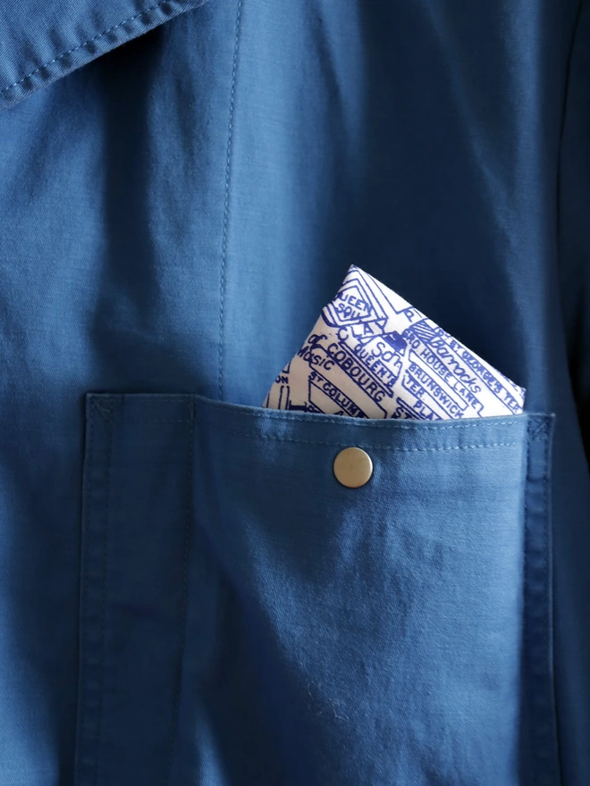 A Mr.PS Leeds map hankie tucked in the top pocket of a blue jacket