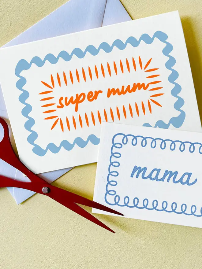 'Super Mum' hand printed card on a yellow table. 