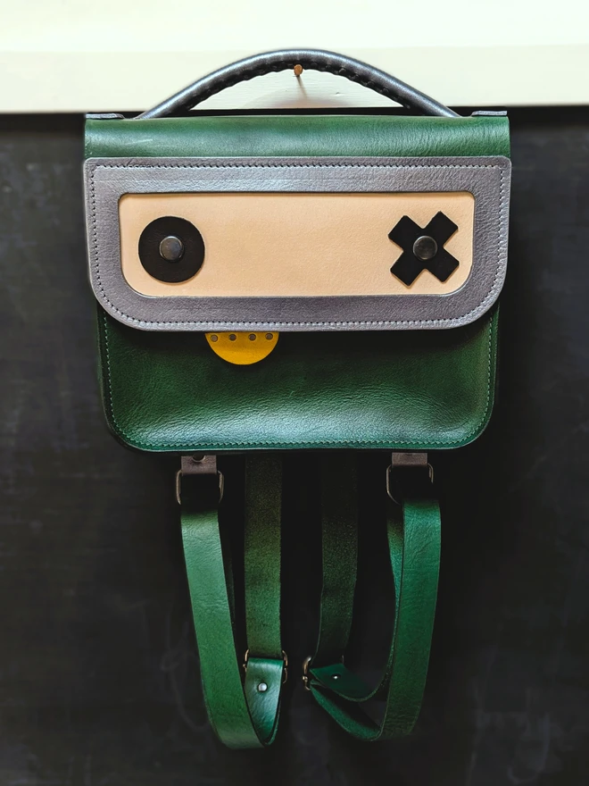 Green Robot backpack, front view.