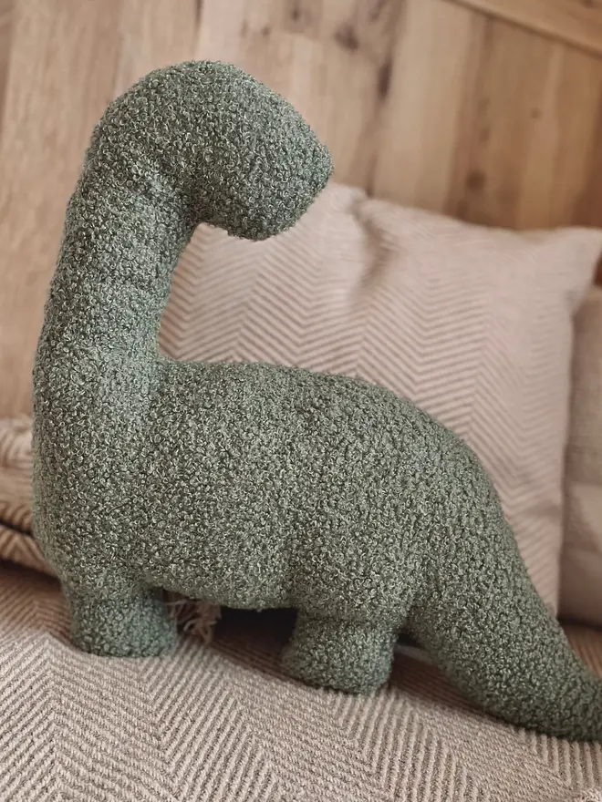 boucle dinosaur pillows. a green diplodocus.