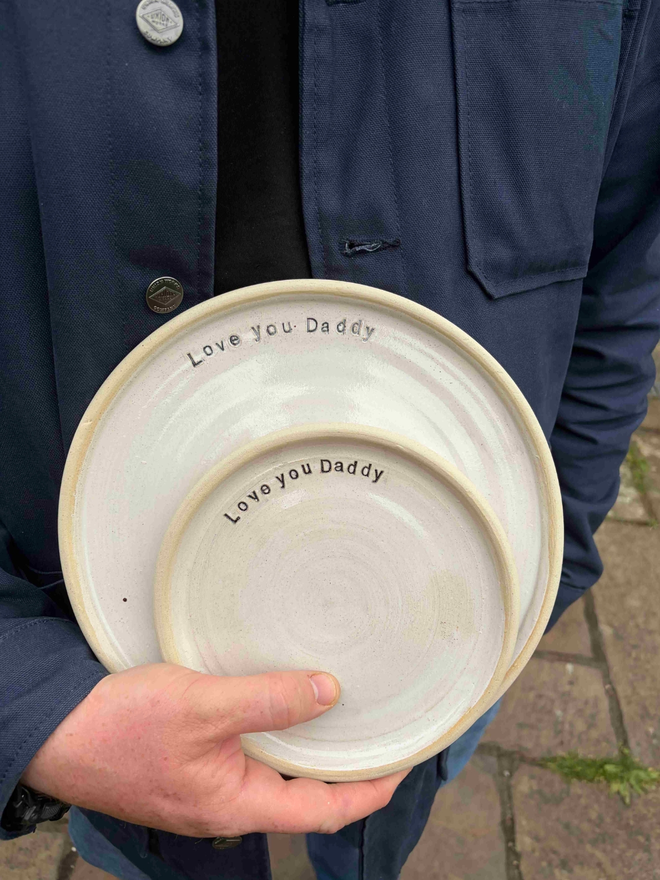 Handmade stamped ceramic plate with the phrase 'love you daddy'