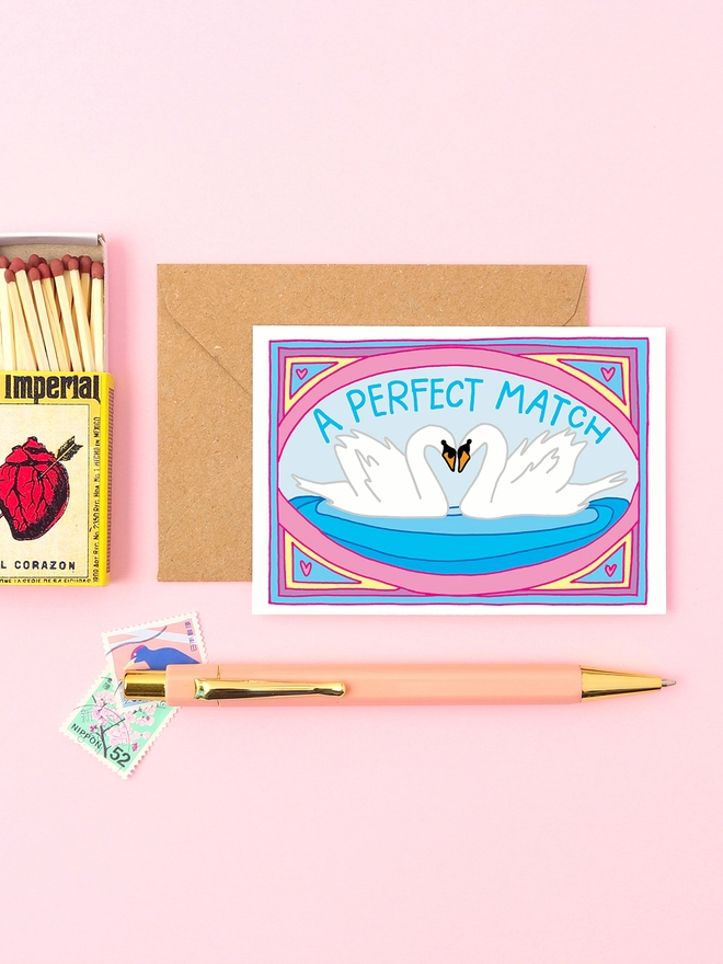A perfect match! A mini anniversary / Valentines or wedding card. Featuring a pair of swans in love