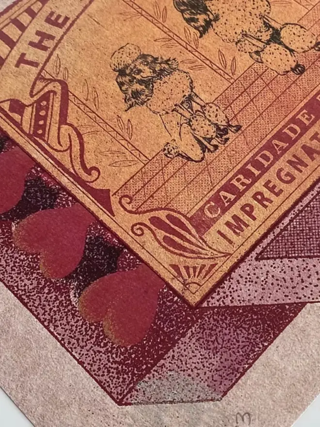 An illustrated image of a vintage matchbox. The matchbox is a faded golden yellow with red details. It features three poodles standing side-by-side. The poodles are highly stylized, with fluffy fur and topiary-like shapes. The poodle on the left has a puffball on its head, the middle poodle has a large, rounded bouffant, and the poodle on the right has its hair styled into a single upright spike. Above them, the text reads, "THE SLAY SISTERS," and below them, it says, "CARIDADE TRADE MARK IMPREGNATED SAFETY MATCH." The matches on the side of the box are a heart shape, and the entire image has a grainy texture, like it was screen-printed.