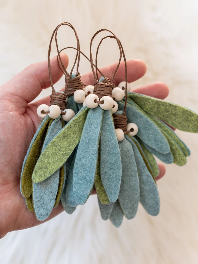 A handful of felt mistletoe hanging decorations 