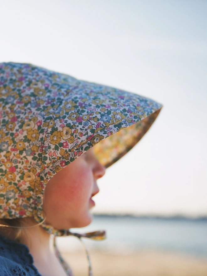 Baby in her liberty sun bonnet