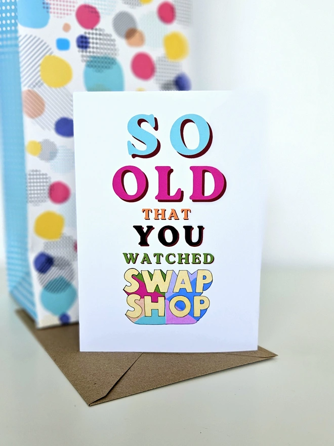 A nostalgic card that says So old that you watched Swap Shop in colourful retro style fonts on a white background.