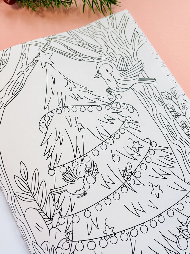 Christmas colouring book for adults and kids featuring woodland animals and winter scenes.