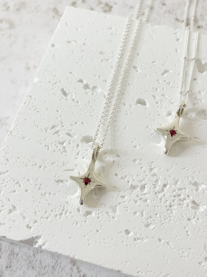 Hand made 'You're A Star' charm necklace made from 100% recycled sterling silver, set with a Ruby, the birthstone of July. A perfect gift for your friend, girlfriend or wife for their birthday or just to remind them how much you love them! Add a personalised initial and send straight to your special someone. Made by Celina C Jewellery, a small business in the UK, find on Holly and Co.