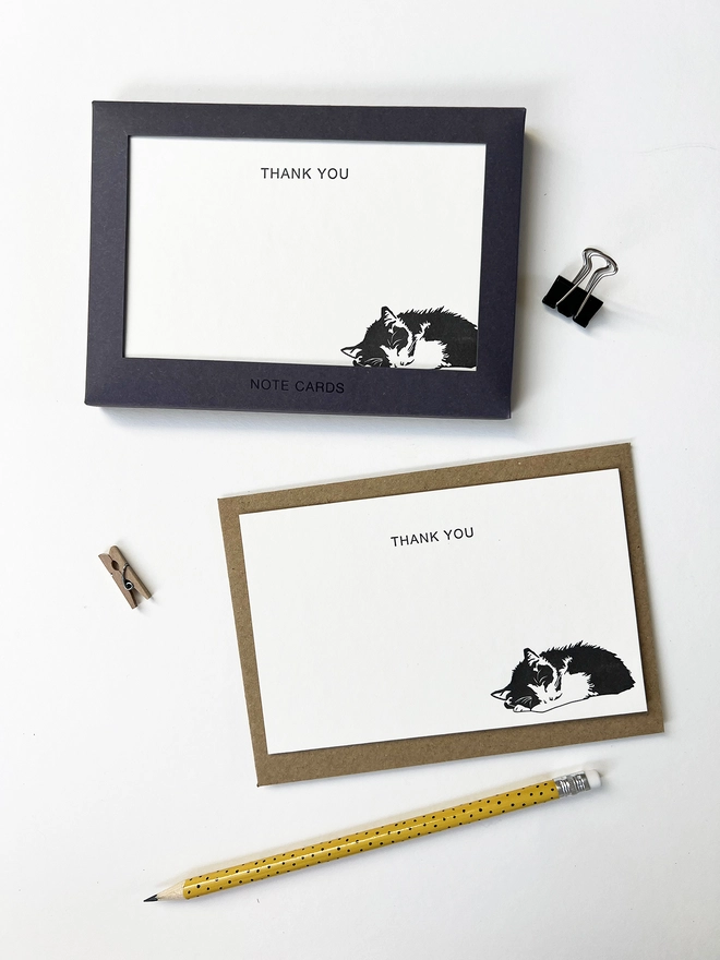 Boxed flat correspondence cards illustrated with a sleeping cat