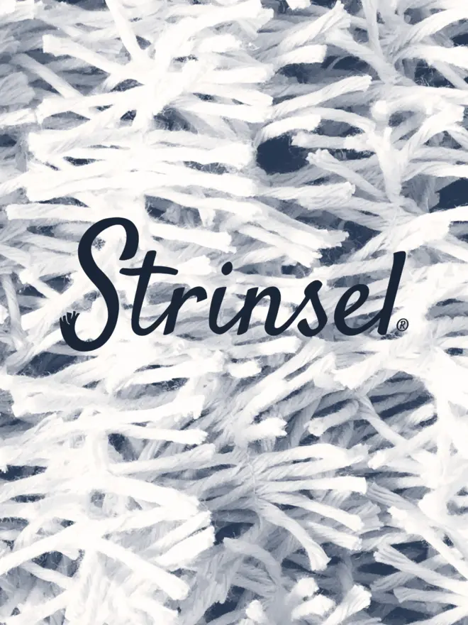 Strinsel logo in midnight navy on a duotone off-white and navy close up image of cotton string tinsel AKA Strinsel