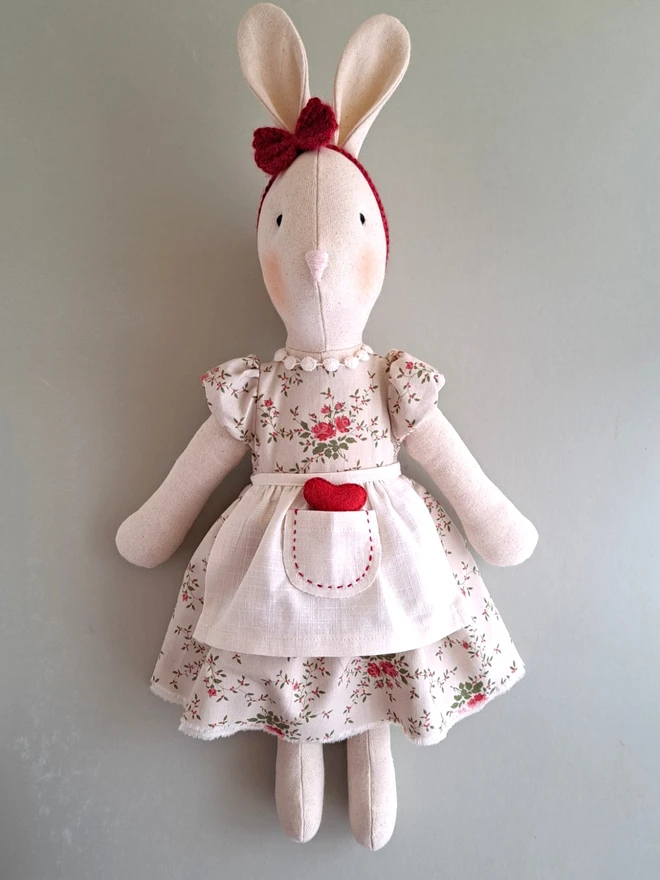 Handmade Veronica Bunny heirloom toy made from natural linen, shown on a neutral background to display size and details