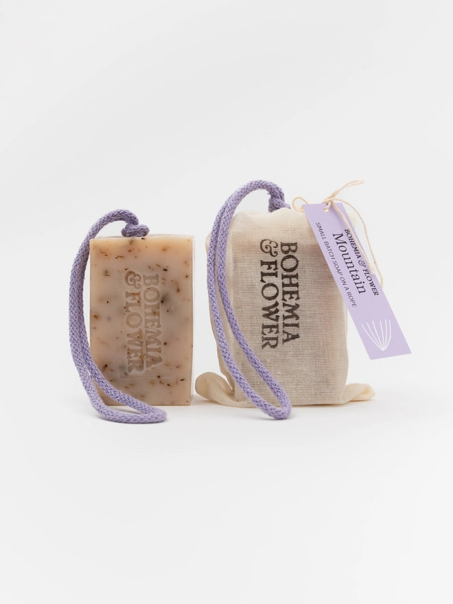 Mountain Soap on a Rope shown with and without its pure cotton drawstring bag – handmade British shower soap with lavender, patchouli, and fennel, plastic-free and ready for gifting