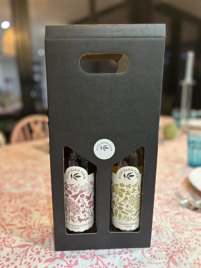 Build Your Own Gift Box (Set Of 2), a set of two cordials sitting on a table. 