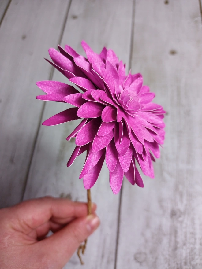 side view of a pink dahlia flower, made from handprinted papers